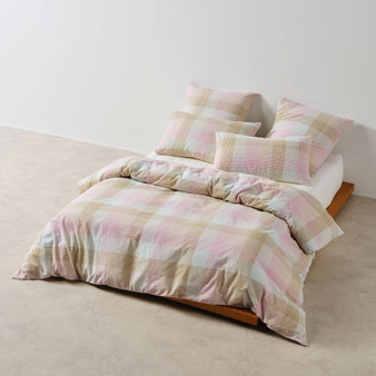 Bloomfield Pink quilt cover set styled on bed with matching pillowcases