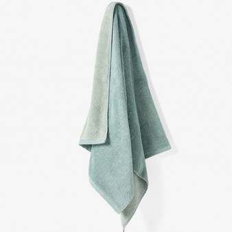 Linen House Otway Salt Water towel hanging to show dual colourway - lightweight, yarn-dyed cotton terry with soft texture.