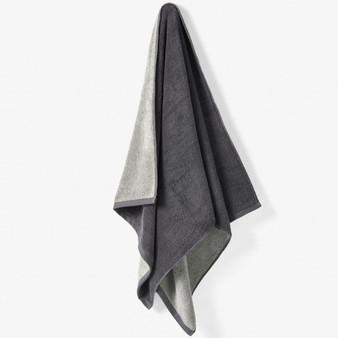 Linen House Otway Shadow  towel hanging to show dual colourway - lightweight, yarn-dyed cotton terry with soft texture.