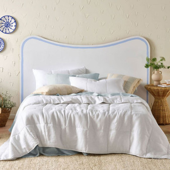 Linen House Nimes White coverlet styled on a bed, showcasing its vintage linen drape and generous queen–king fit