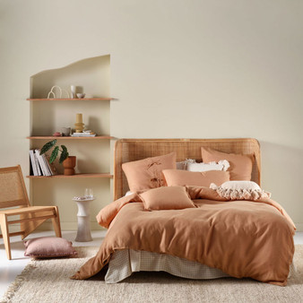 Styled bedroom setting featuring Linen House Nimes Quilt Cover Set in clay