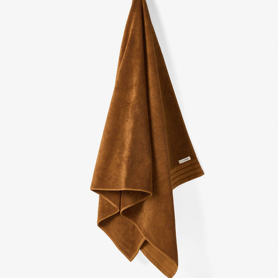 Linen House Marley rust towel hanging with chenille stripe detail