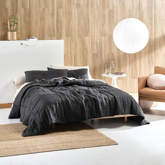 Linen House Nimes Magnet coverlet styled on a bed, showcasing its vintage linen drape and generous queen–king fit