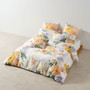 Lyra quilt cover by Linen House featuring hand-painted vintage floral design in warm apricot and honey tones on cotton sateen