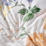 Detail of Lyra cotton sateen fabric showing hand-painted vintage floral illustration