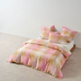 Linen House Sunrise Check Bubblegum Quilt Cover Set in bubblegum pink and curry hues