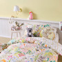 Styled bedroom setting with Bush Folk quilt cover set by Linen House Kids featuring hand-painted native Australian animals and flora