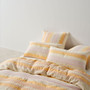 Campbell quilt cover set styled on bed with summer palette