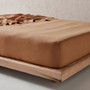 Close-up of pure linen fitted sheet in Clay