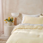 Surf Wash Butter yellow quilt cover styled with matching white sheets