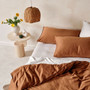 Linen House Surf Wash Rust quilt cover styled with neutral bedding