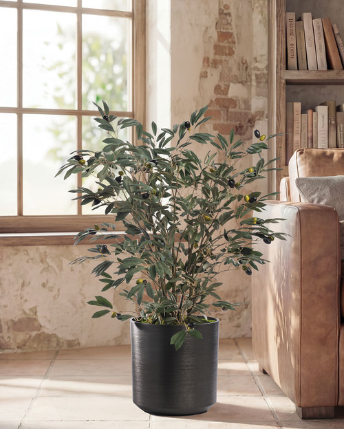 Faux olive tree plant with lifelike foliage and olives in a liner pot, shown styled in a decorative metallic container for home décor