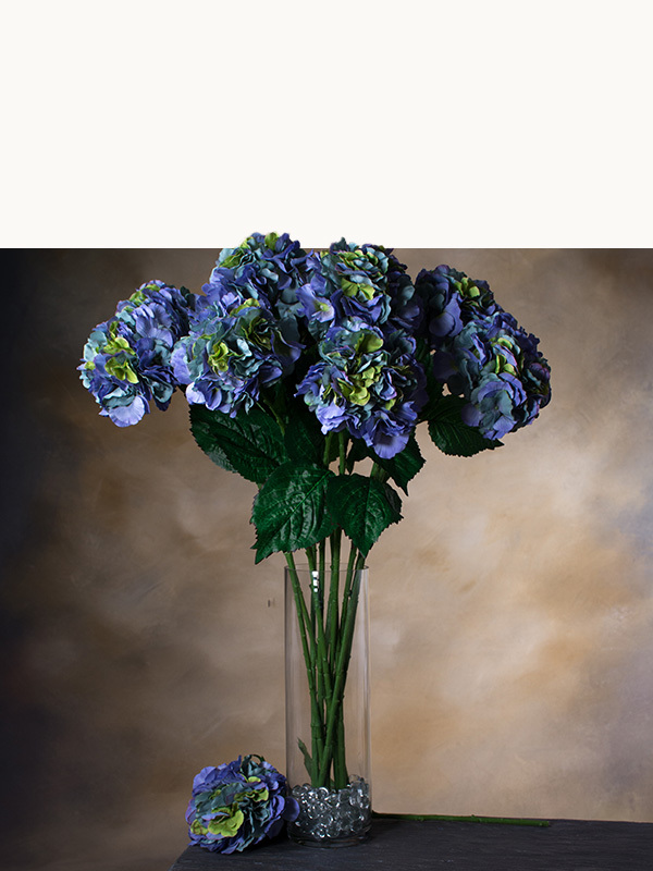 Artificial floral stems by Petals including realistic faux roses, greenery, seasonal flowers, and botanical accents for custom bouquet styling and decorating.