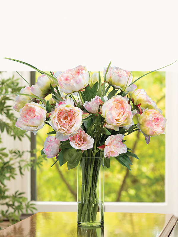 Premium handcrafted faux floral arrangement by Petals featuring lifelike roses and seasonal blooms in soft pink, coral, cream, and red tones.