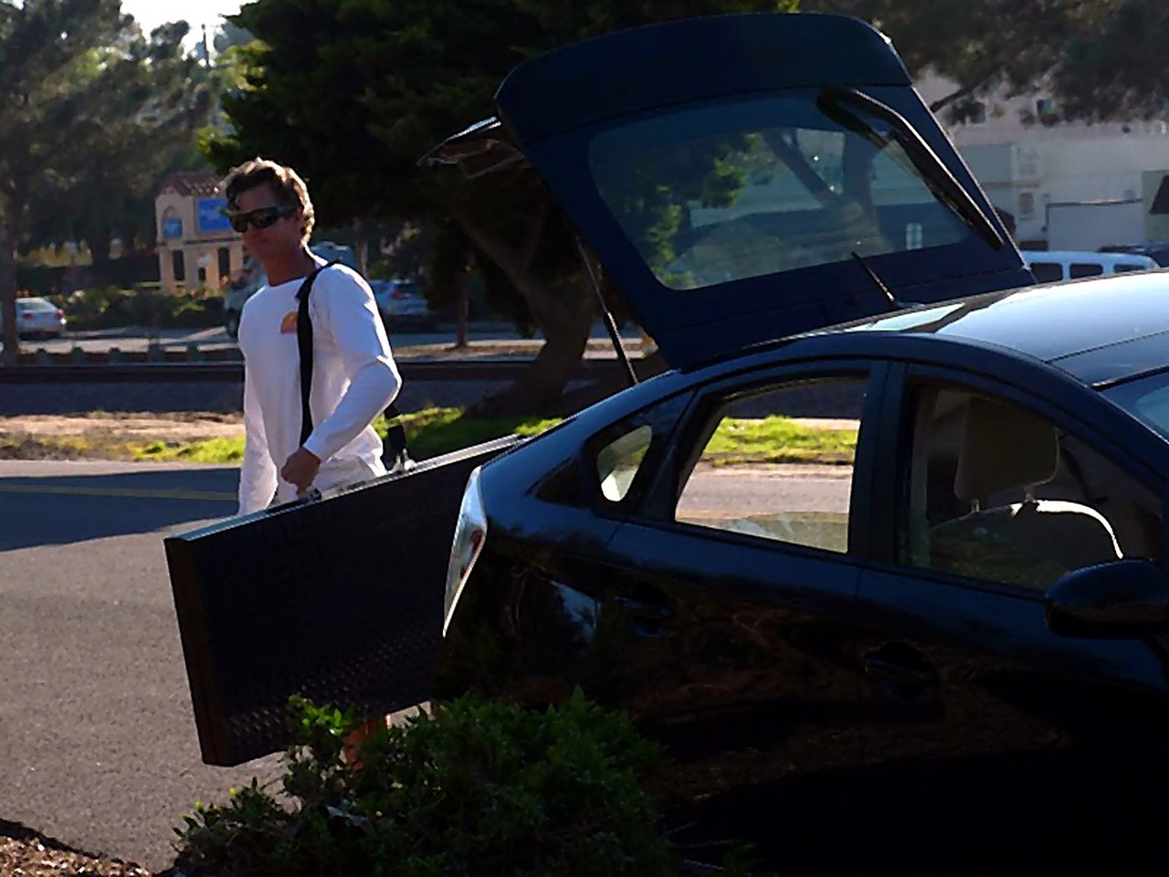 A MyStage portable stage deck being loaded into the back of a car