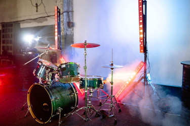 How to Elevate Your Drummer for Better Visibility: The Complete Drum Riser Height Guide