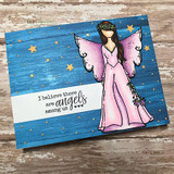 Card with the angel girl in pink on a starry blue panel and 'I believe there are angels among us'.