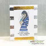 The mother in a blue striped top holding her baby on a card with gold and silver strokes, with "a mother's arms are more comforting than any other."