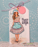 The girl colored in soft teal and tan on a kraft gift tag tied with pink twine, reading 'Peace Love Hope.'