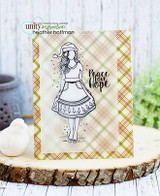 The uncolored line-art girl stamped on a green plaid panel, captioned 'Peace Love Hope.'