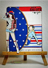 Navy star card on a wooden easel with a colored saluting girl in patriotic clothes and a small panel stamped 'we SALUTE you'.