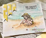 Card with the beach girl colored in a yellow hat on a watercolor shoreline of teal water and tan sand, 'BE HAPPY and smile' stamped at the top with yellow flag accents.