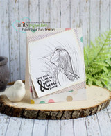 Simple kraft and polka dot card standing on a wood slice beside a small white bird, the girl stamped in crisp black line work with the sentiment "keep your head up & your heart strong".