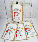 Stacked kraft tags with red-hatted snowmen holding stars and 'Shine Bright.'