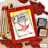 Card with a leaf in autumn colors over kraft, 'feeling blessed'
