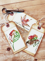 Two tags with colorful stamped leaves