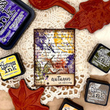 Card with a leaf over script paper, 'autumn is calling'