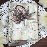 Card with a leaf softly colored pink over a doily, 'true love lasts forever'
