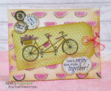 Watermelon print card with a green polka dot tag, the tandem bike with a flower basket, postmarks in the corner and a 'Let's enjoy the ride together!' tag