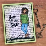 Card with a handwritten scripture script background and Nia in a green top and blue jeans, over 'You got this Girl' with a black bow.