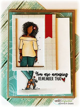 Teal and gold framed card with Nia in a yellow top and dark jeans, above 'You are amazing remember that.'