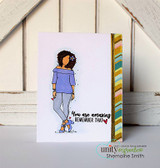 Clean white card with Nia in a lavender top and grey jeans beside a striped strip, over 'You are amazing remember that.'