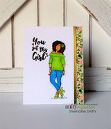 Card with Nia in a green top and blue jeans on a white panel with floral trim, under bold 'You got this Girl.'