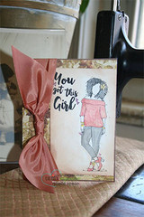 Card wrapped in a pink ribbon; Nia is colored in soft pink and grey beneath 'You got this Girl.'