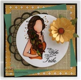 Gold and green layered card on black with a doily, the girl colored in warm oranges and browns beside a yellow paper flower, and "Your vibe attracts your tribe" stamped alongside.