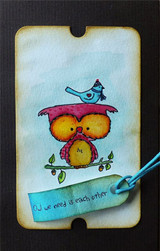 Blue inked ticket tag with the owl colored in magenta and gold, stamped 'Owl we need is each other' on a banner.