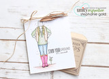 Handmade card made with Unity Stamp Co’s Lux Girl red rubber stamp set — a sketched girl standing hands-in-pockets in a beanie, layered jacket and boots — stamped and colored, with the sentiment “Stand your ground it's sacred”.