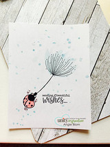 Clean white card with the delicate dandelion wish, ladybug and 'sending beautiful wishes.'
