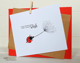 Card with the dandelion and ladybug on white over a red panel, 'hang in there lady.'