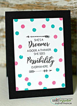 Framed card with the 'She's a dreamer' text on a black-and-teal polka-dot background.