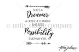 Itty bitty line-art stamp of a text block with arrows reading 'She's a dreamer, a doer, a thinker. She sees possibility everywhere.'