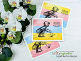 Four small pastel-washed cards, each stamped with the girl and duckling and “FRIENDS get us through rainy days,” arranged with white orchids.