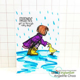 Graph-paper card with hand-drawn rain and a blue puddle: the girl in a purple coat and yellow boots with her duckling under the rainy-days sentiment.