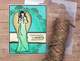Angel girl in green on a teal medallion card, 'I believe there are angels among us'.
