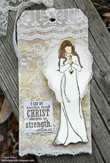 Angel girl in white on a lace-layered tag, faith sentiment.