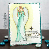 Angel girl on a teal distressed card, 'may the miracle of Christmas shine brightly on you'.